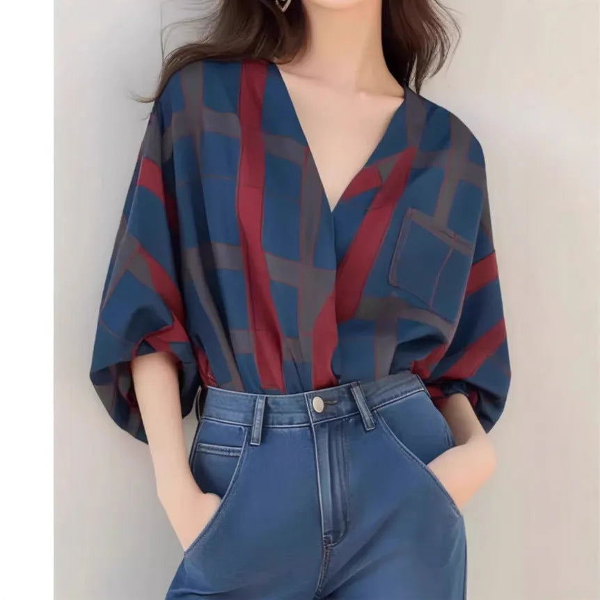 Women's loose-fit pullover top with painted pattern, short length, and drop-shoulder sleeves in polyester
