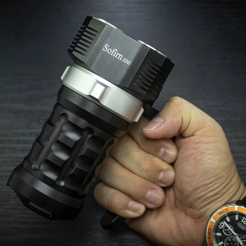 Aluminium alloy diving flashlight showing 18cm length, displayed with optional battery charger kit.