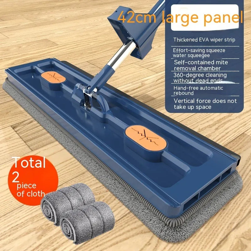 Large flat mop with long stainless steel handle, blue rotating head, and integrated scraper on a hardwood floor.