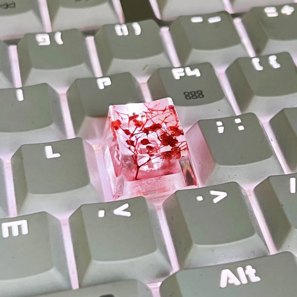 High transparency resin starry sky keycap for mechanical keyboard in green, pink, red, and violet colours.