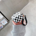 Black and green checkerboard lattice pattern TPU hard shell case covers for AirPods with optional lanyard and pendant attachments.