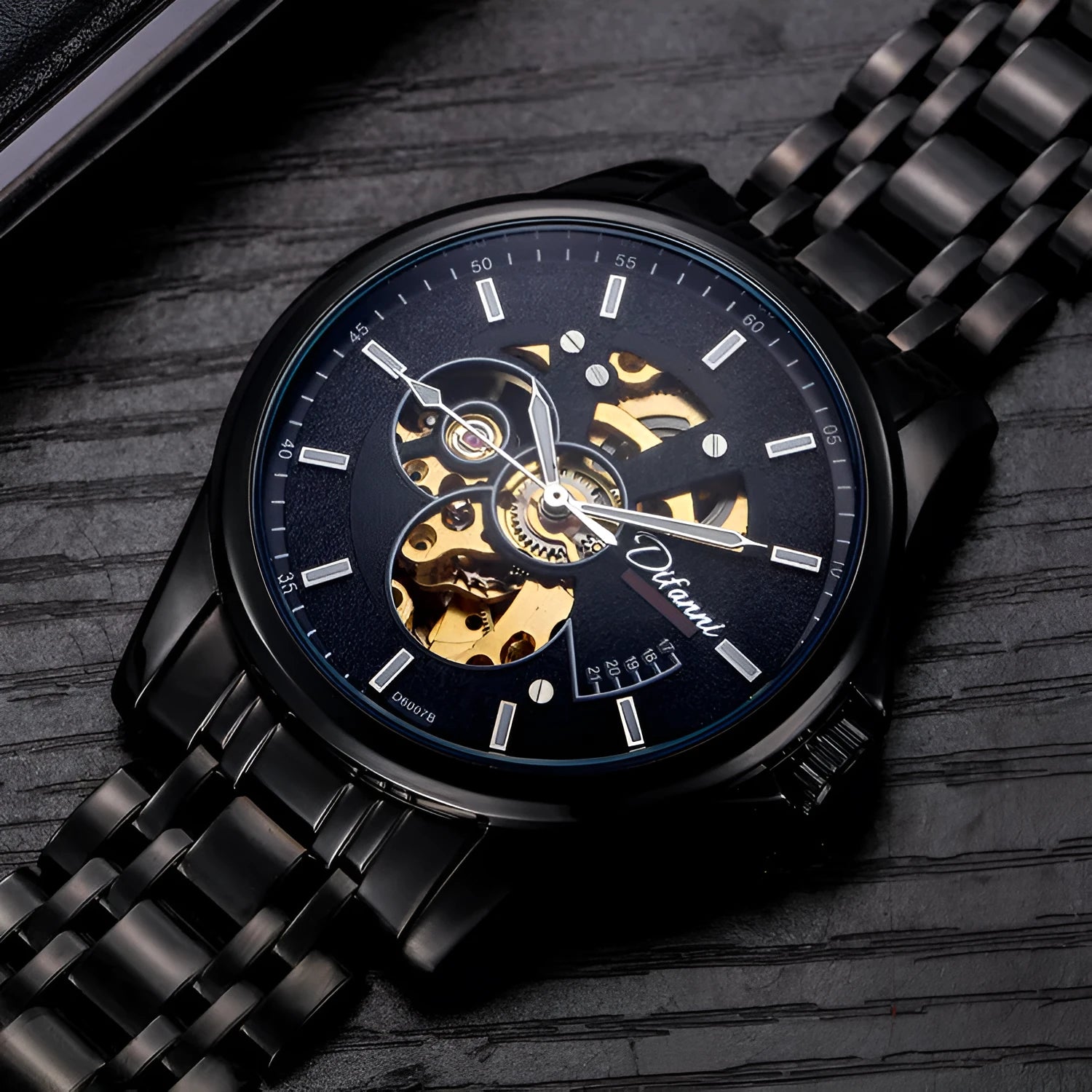 Mechanical automatic watch with 42mm stainless steel case, black dial, mineral glass, and steel bracelet on light background