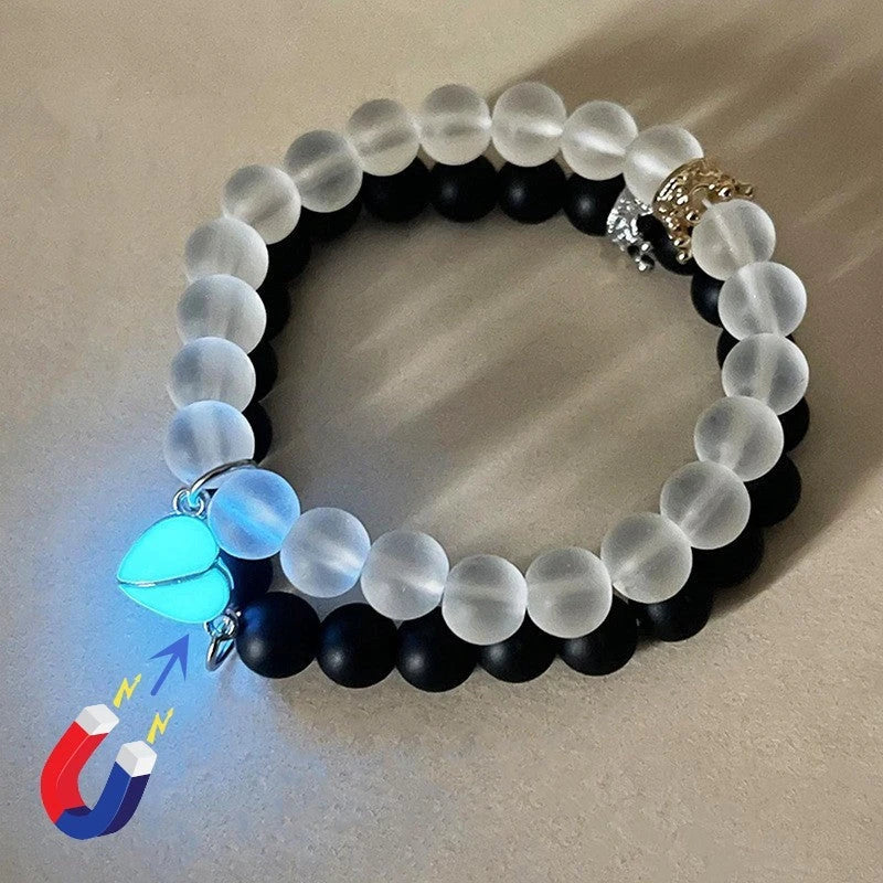 Luminous glow-in-the-dark crown bracelet set in white and black colors, showcasing a unique design and enchanting nighttime glow