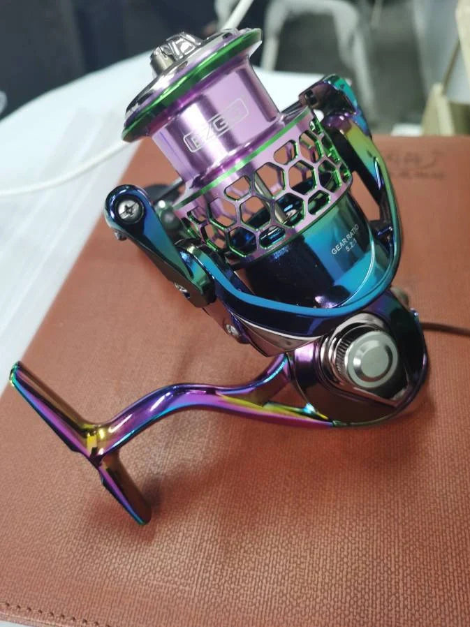 All-metal spinning fishing reel with stainless steel bearings for saltwater use, showing interchangeable handle