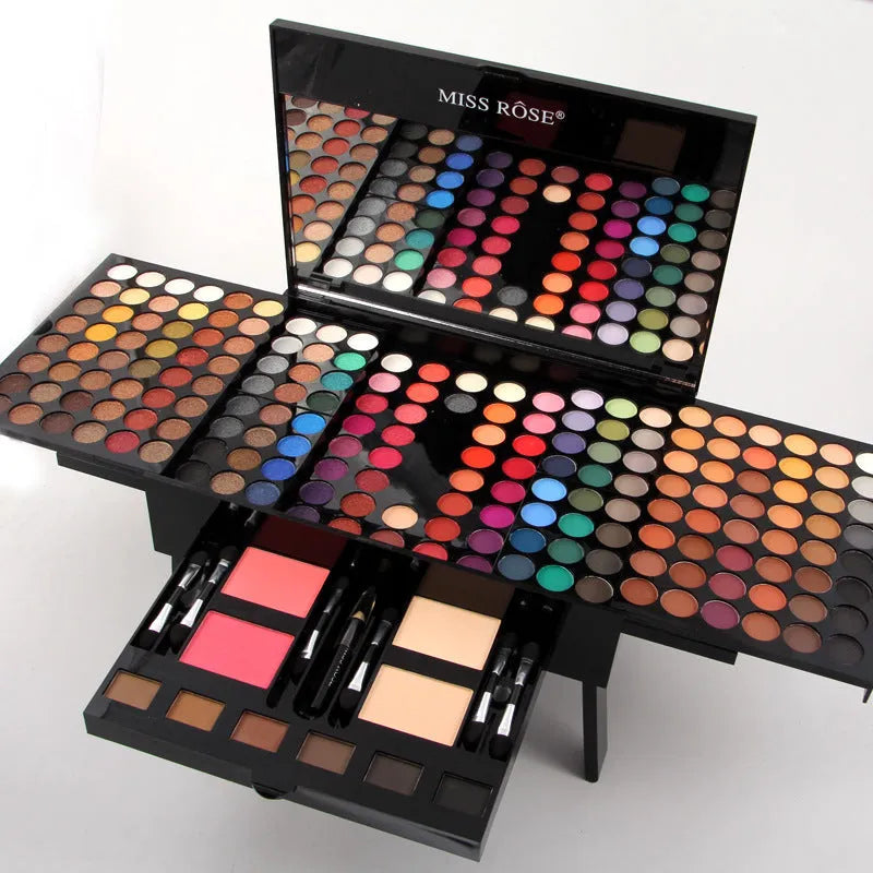Piano-shaped box open to show 180 colour eyeshadow palette with blushes and contour powders
