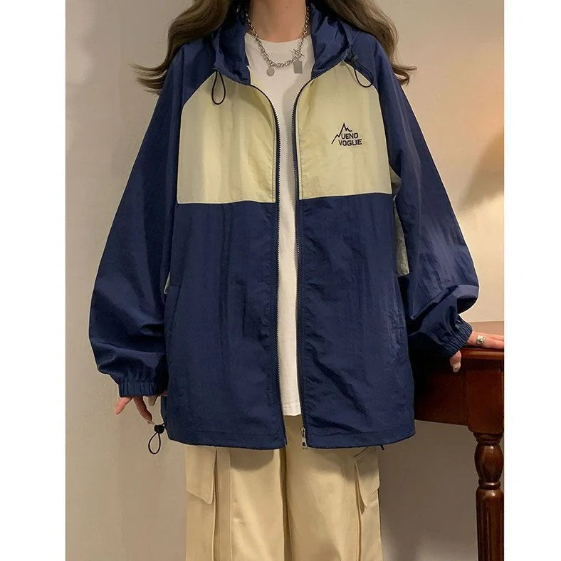 Women's summer sun protection top with raglan sleeves in apricot colour showing loose fit and splicing details