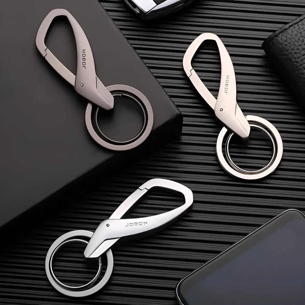 Zinc alloy double ring keychain for car keys in Black, Chrome, or Nickel colour, shown at 8.3x3.5cm size.