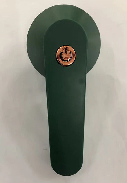 Green and white USB-powered fabric shaver device for removing pilling from clothing