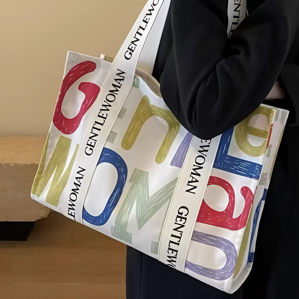 Large canvas women's tote shopping bag with printed design in choice of black letters, coloured letters, or pattern style.