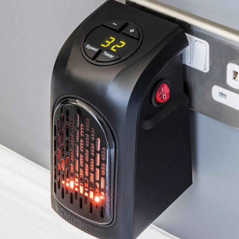 Compact black ceramic fan heater with rotatable EU plug on a desk