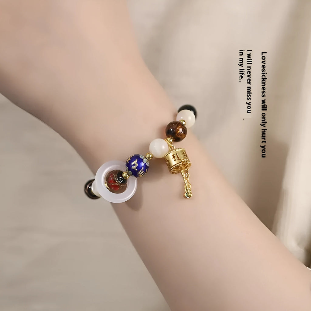 Hand-woven bracelet with fragrant grey coloured glaze, sunstone beads and white lip shell beads