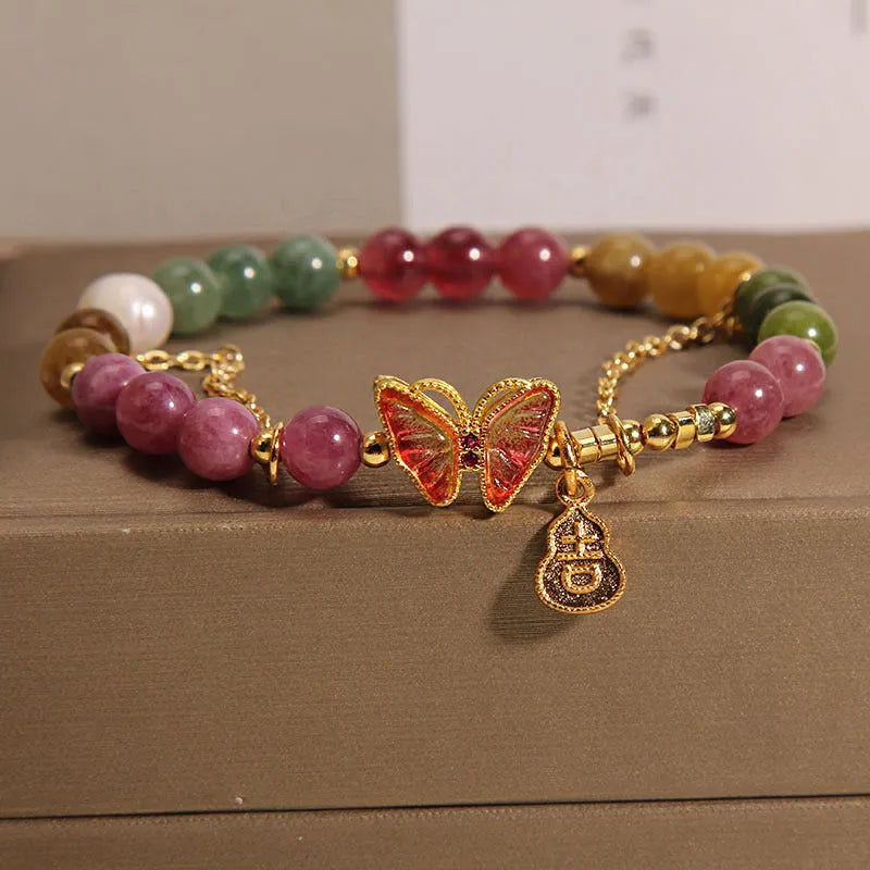 Natural jade green agate bracelet with a carved tourmaline butterfly gourd centrepiece.