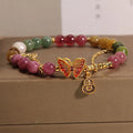 Natural jade green agate bracelet with a carved tourmaline butterfly gourd centrepiece.