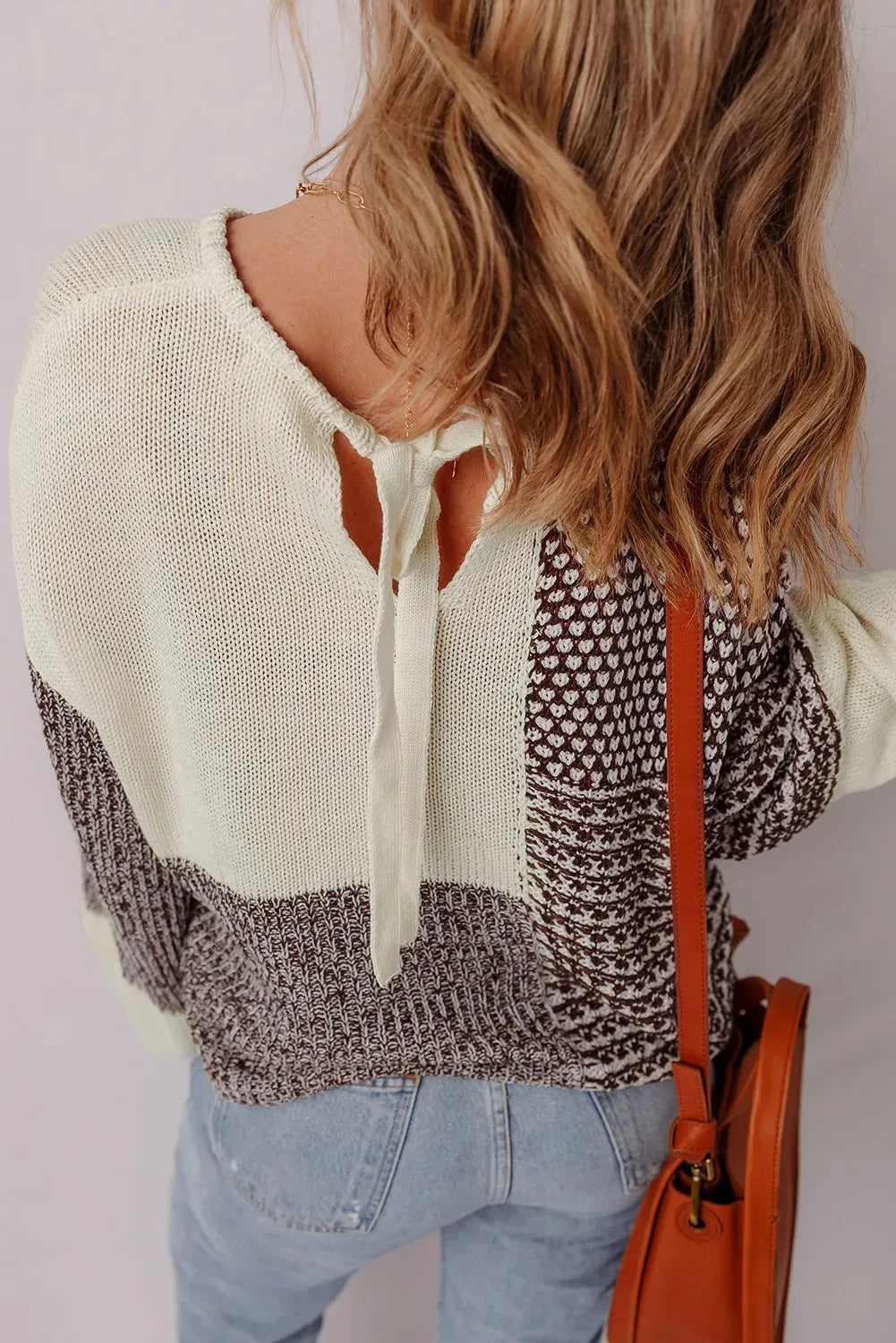 Dark khaki colour block loose sweater with long sleeves, dropped shoulders, and a back tie.