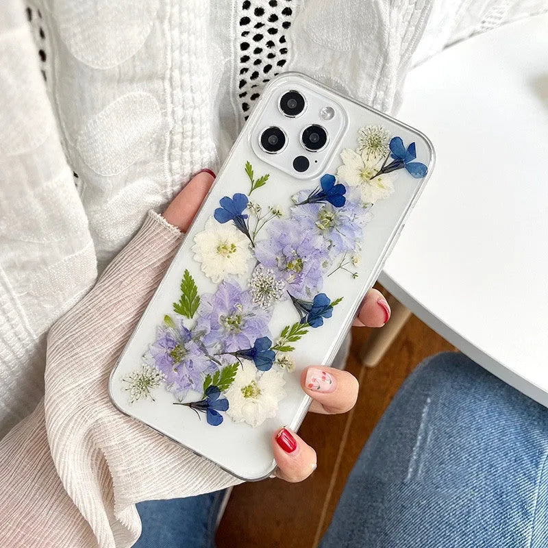 Soft TPU iPhone case with blue and purple dried flower basket design for multiple models.