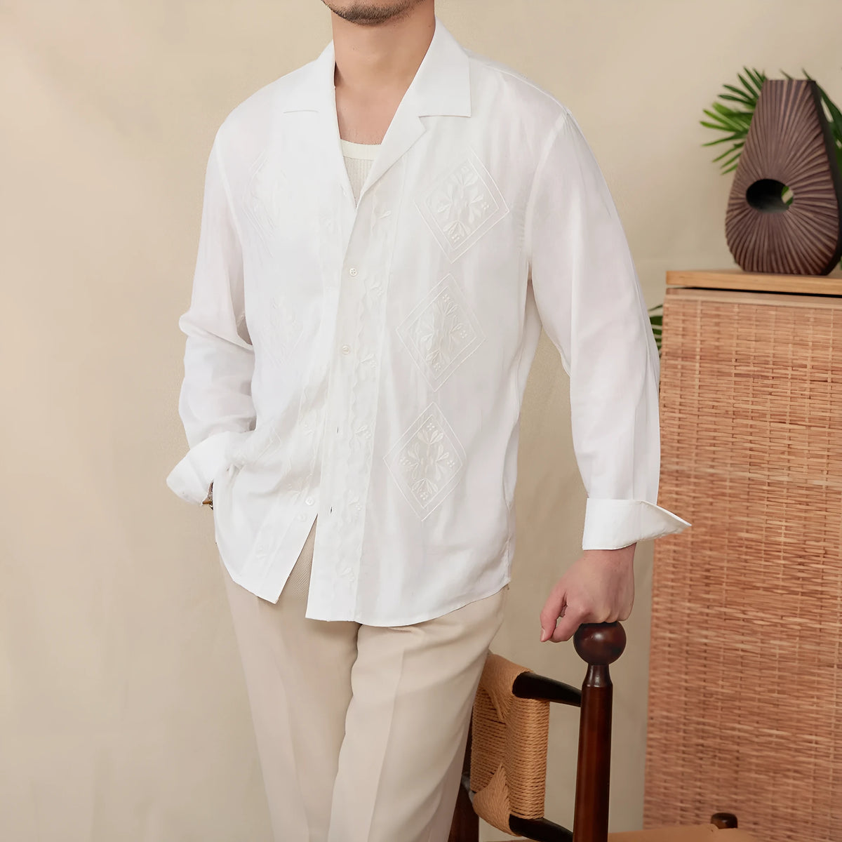 Cotton and linen thin embroidery Cuban collar long sleeve sunscreen shirt in white on a plain background