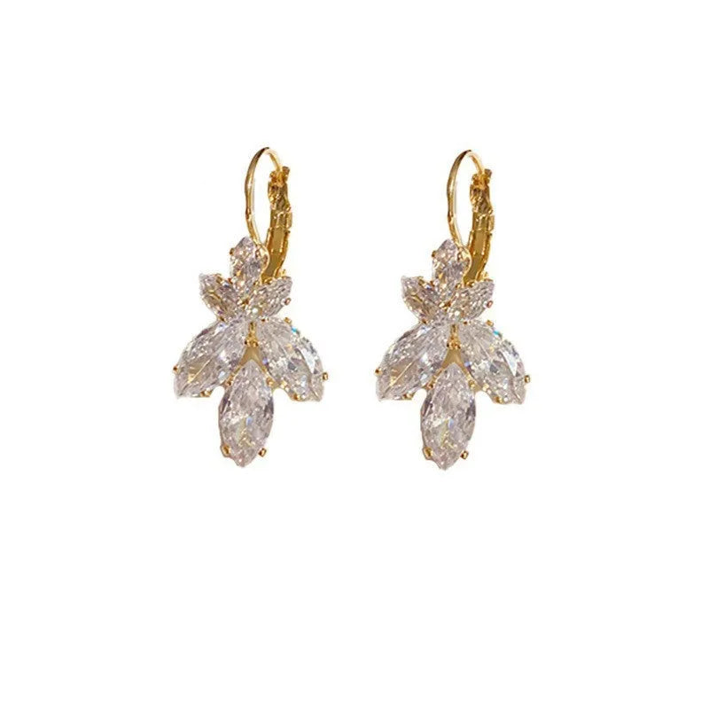 Women's platinum-colour leaf earrings with inlaid shiny zircon stones.