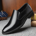 Men's black slip-on business casual loafers with leather toe cap and rubber sole
