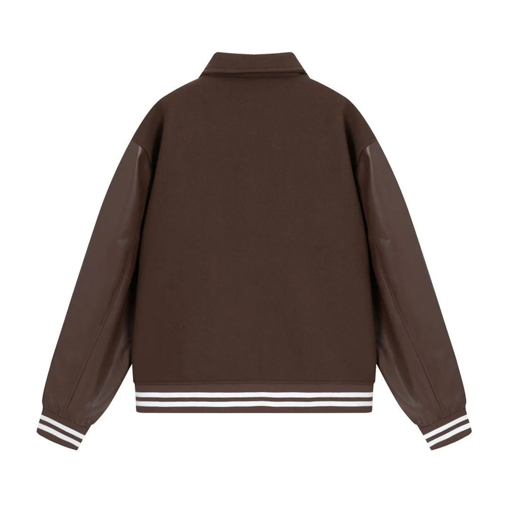 Women's apricot jacket with bone embroidery detail on the front, shown on a hanger.