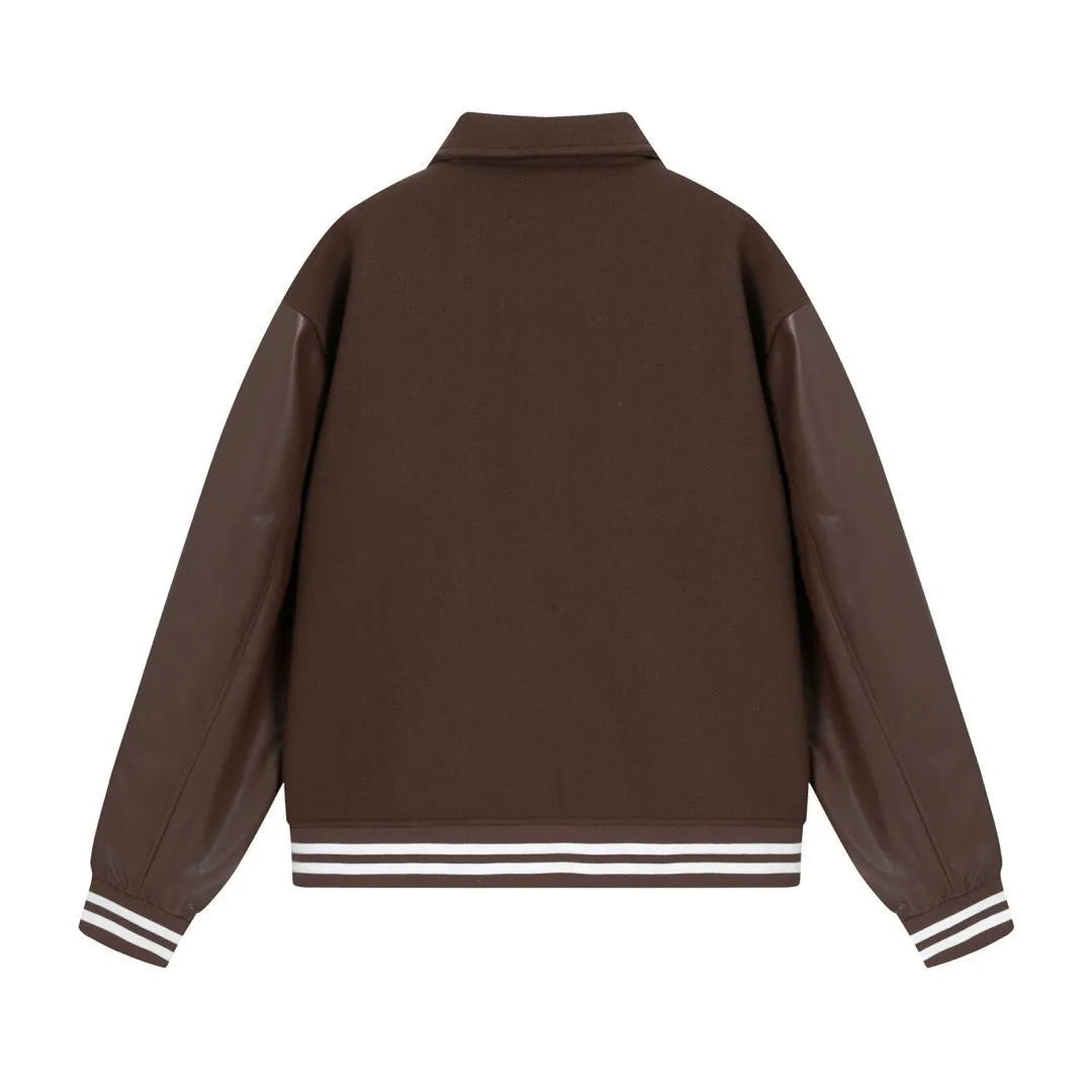 Women's apricot jacket with bone embroidery detail on the front, shown on a hanger.