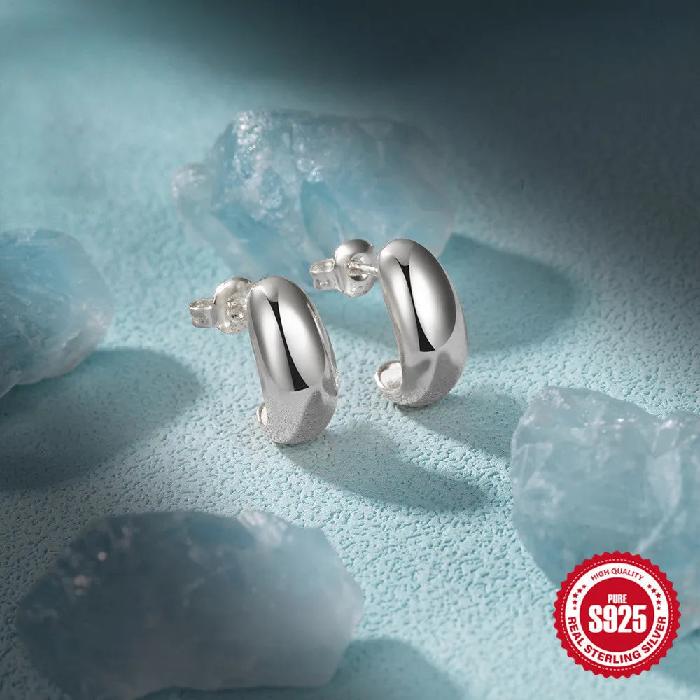 C-shaped geometric stud earrings in 925 sterling silver with glossy gold electroplated finish