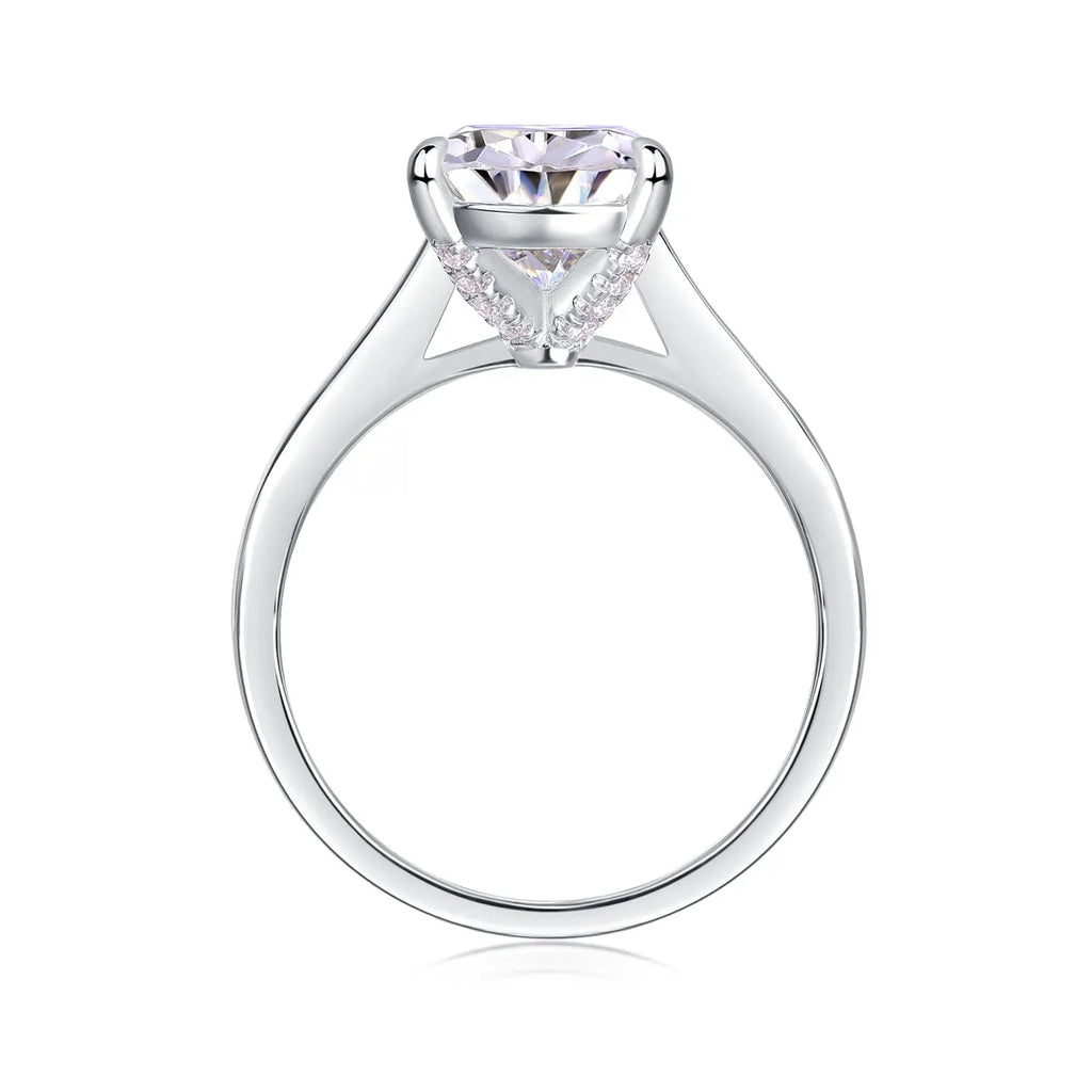 Heart-shaped pear-cut moissanite wedding ring set in S925 silver with platinum plating on white background