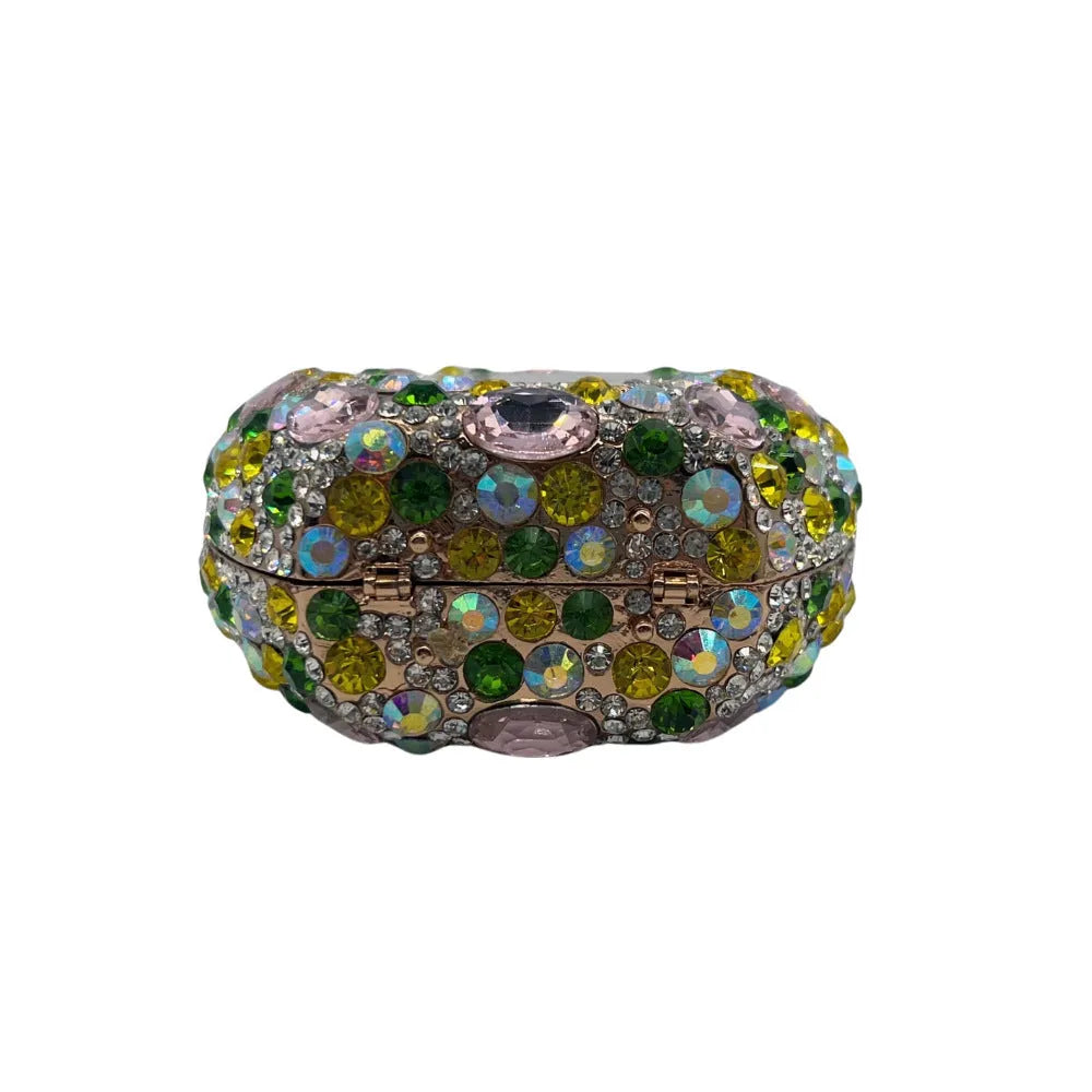 Golden women's hard shell clutch bag covered in sparkling diamonds for formal events.