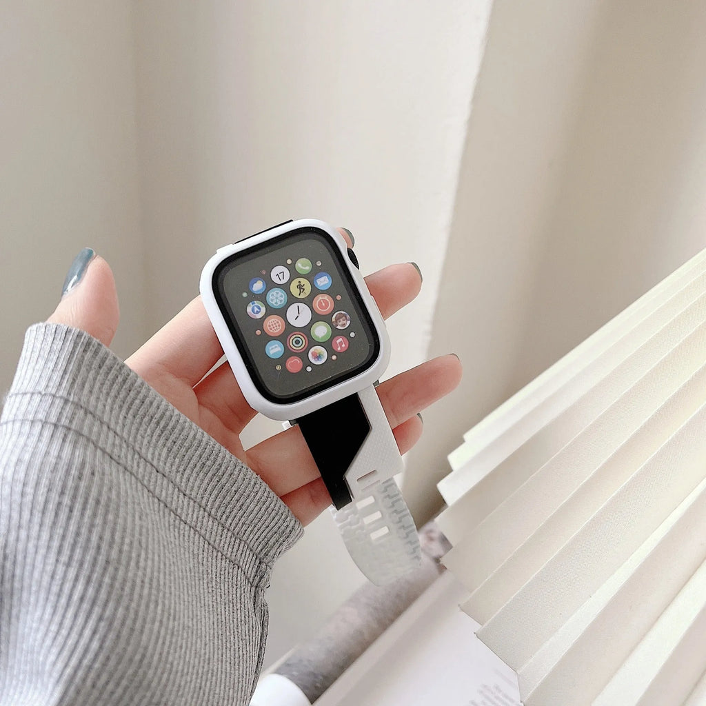 Silicone Apple Watch strap and matching protective case in black and white, two-tone design, for 44mm case size