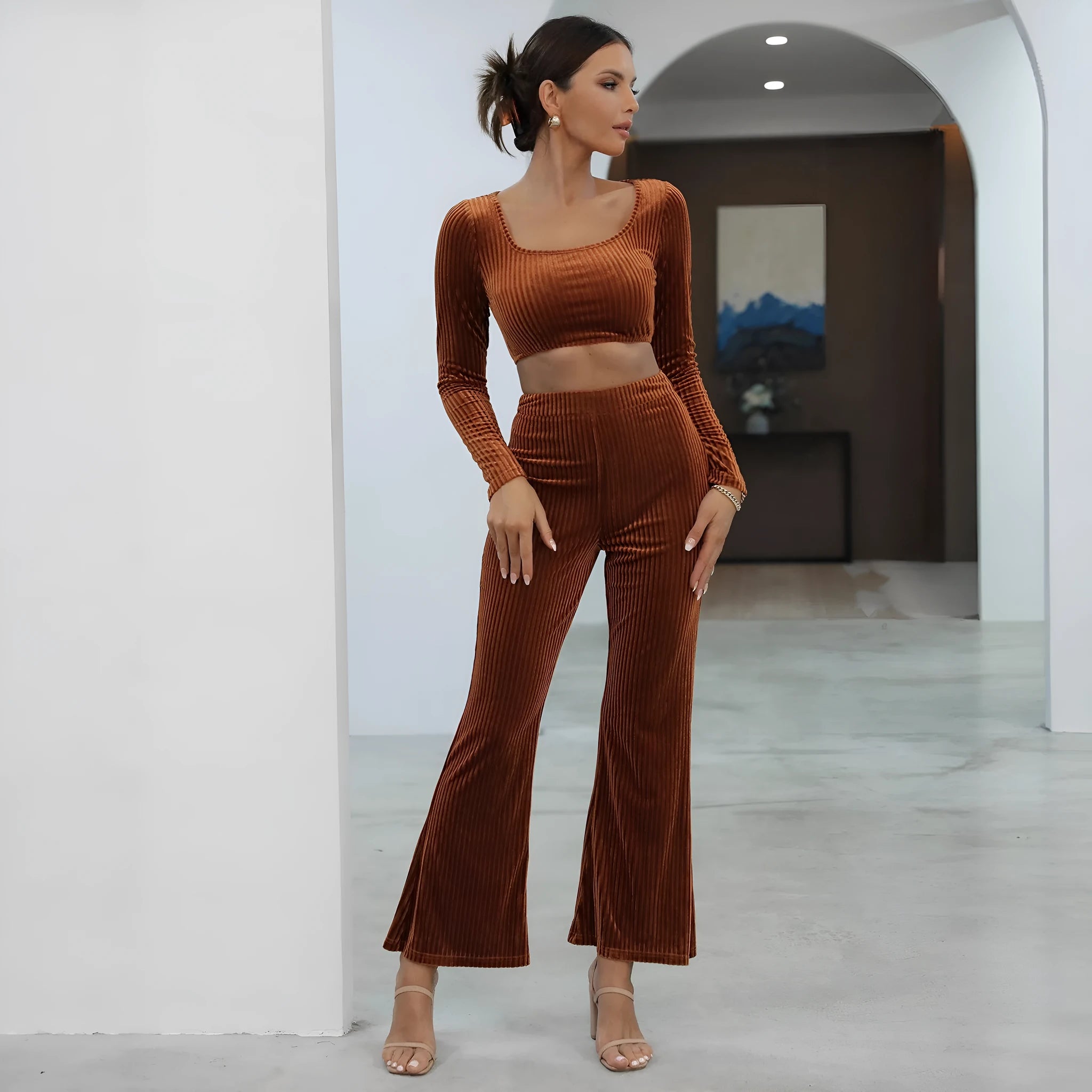 Caramel coloured long sleeve sweater and trouser casual set laid flat
