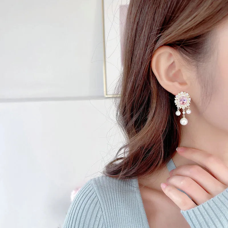 Oval geometric copper earrings with zircon inlays and pearl tassel drops in light purple colour