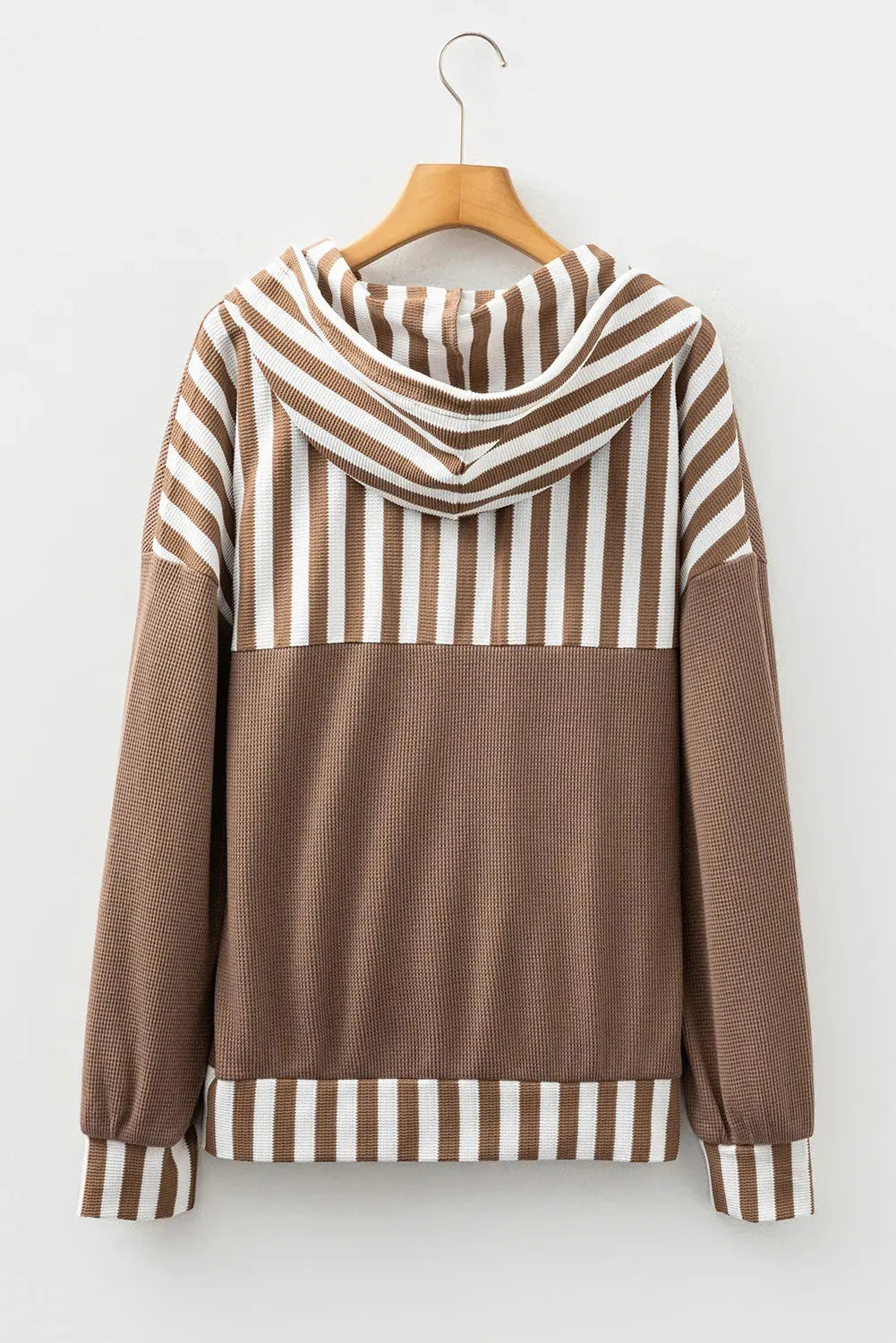 Straw yellow waffle texture hoodie with striped patchwork and a button-front drawstring neckline.