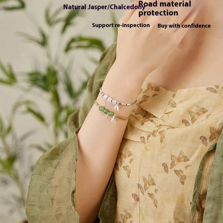 Women's Hetian jade bracelet with handmade woven carrying strap in light green or haze blue chalcedony.