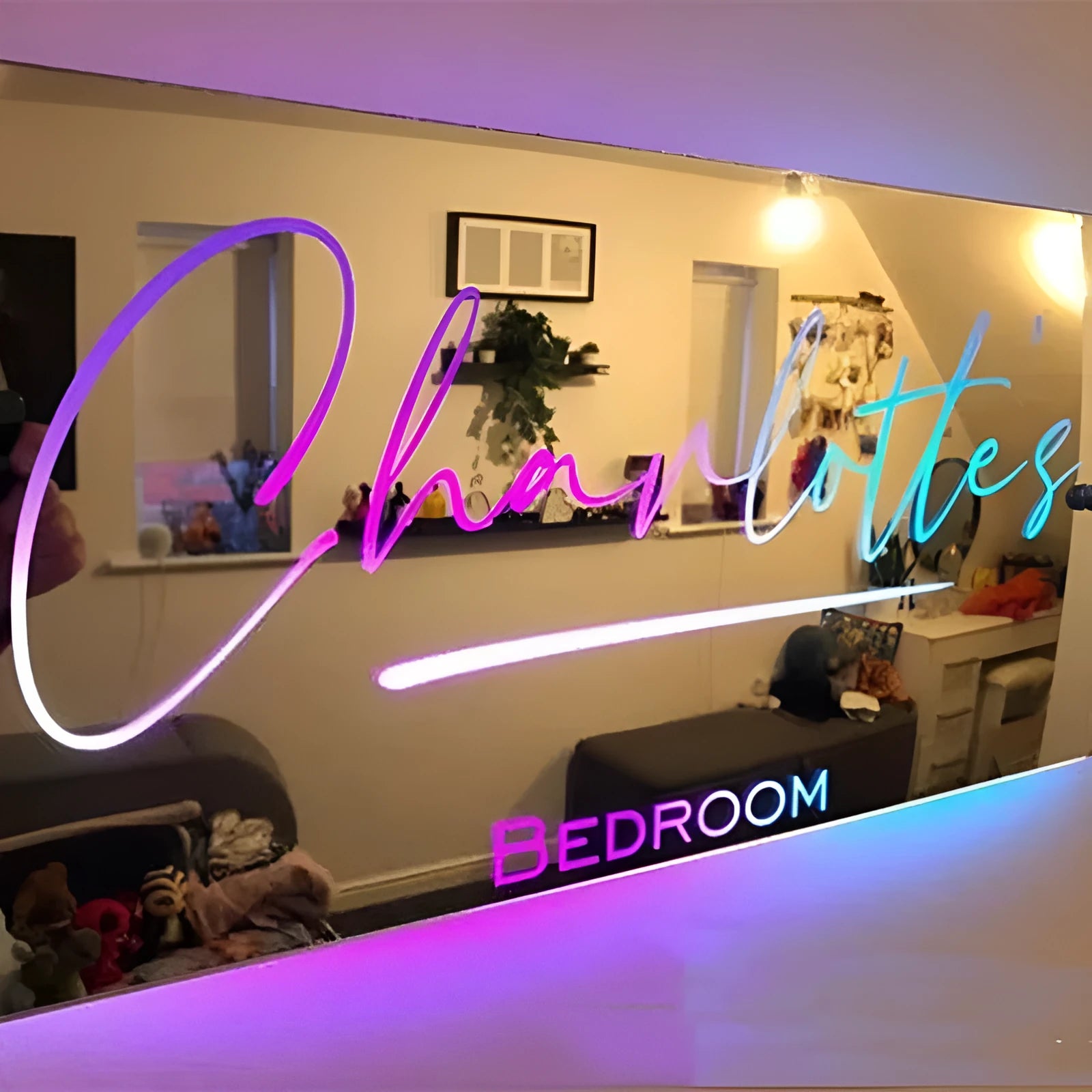 Personalised acrylic name mirror light with LED glow on wall in picture colour
