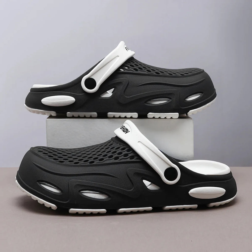 Men's grey closed toe EVA beach slippers with a non-slip sole and flat heel on a poolside.
