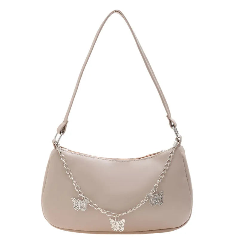 Women's black PU leather crossbody bag with butterfly chain strap and mobile phone pocket