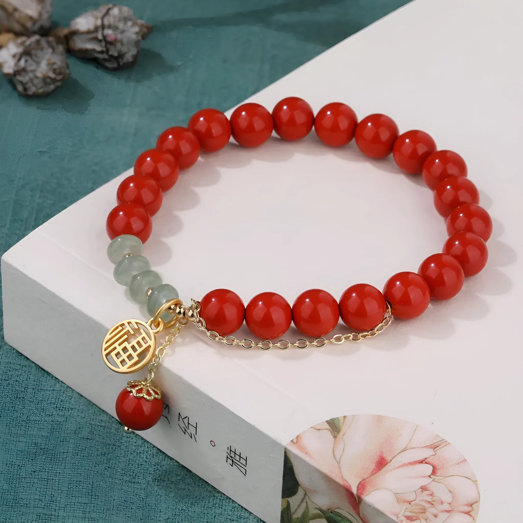 Women's retro bracelet with red sand cinnabar, jade spacer beads, and fu character charm