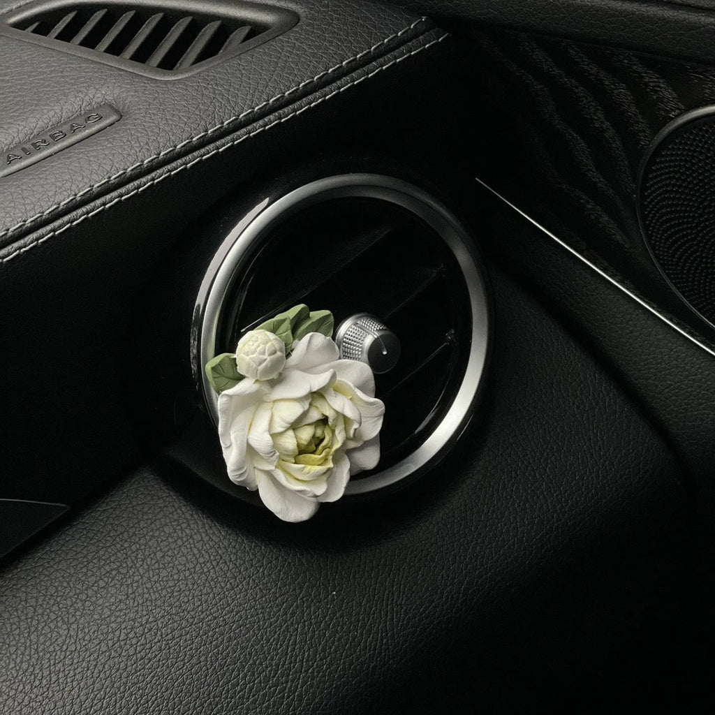 Gypsum solid car air freshener with jasmine oil clipped to vehicle vent