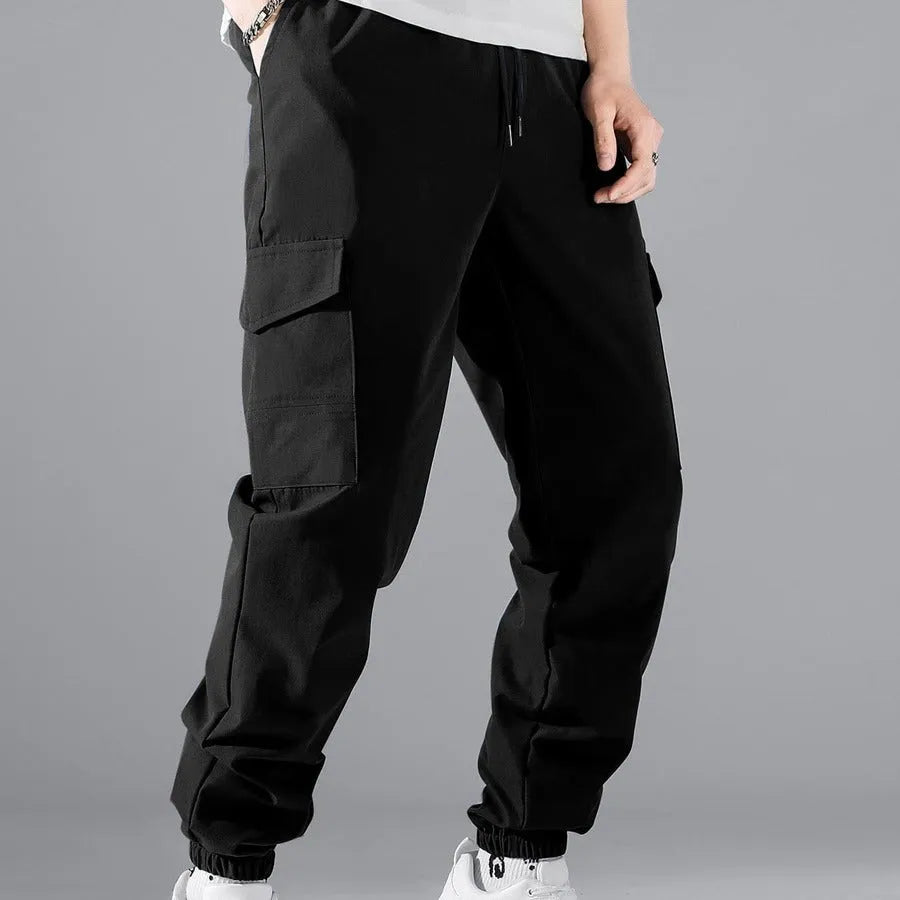 Men's multi-pocket workwear trousers in army green with drawstring waist, side and back pockets, straight leg cut