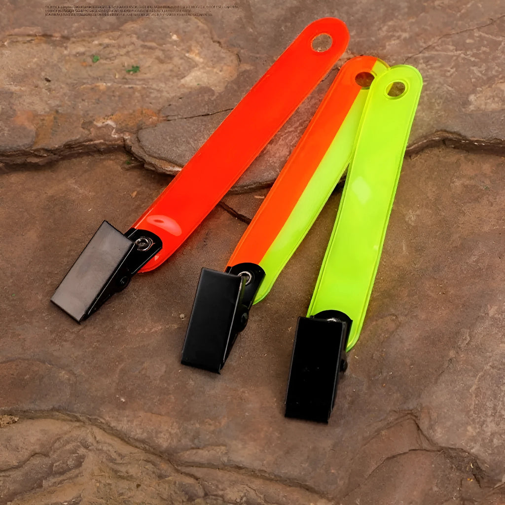 Yellow PVC road sign clip for archery target ribbon marking, size 10.3 cm, on a range background