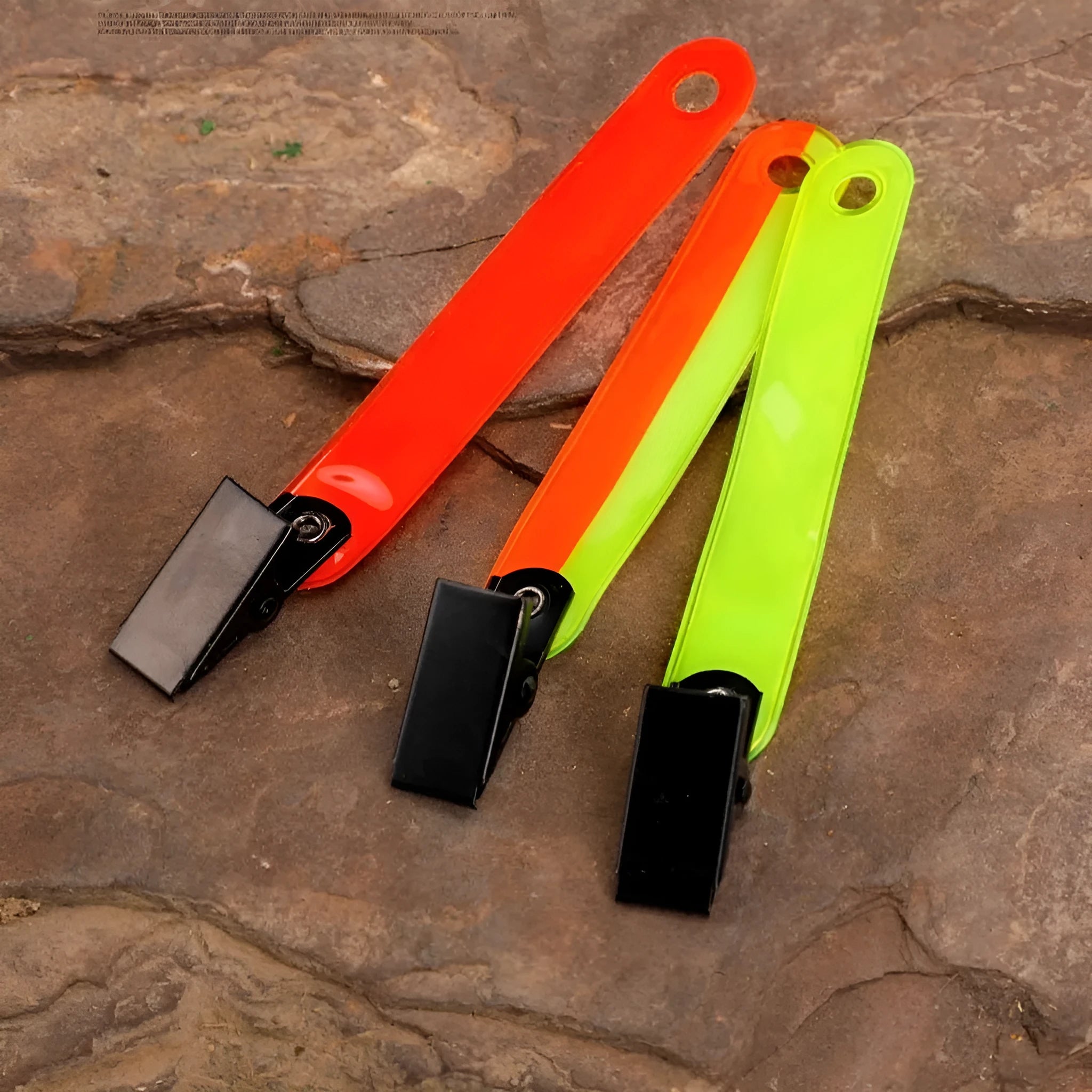 Yellow PVC road sign clip for archery target ribbon marking, size 10.3 cm, on a range background