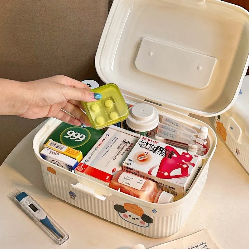 White double-layer plastic storage box with a removable central divider, shown with labelling stickers.