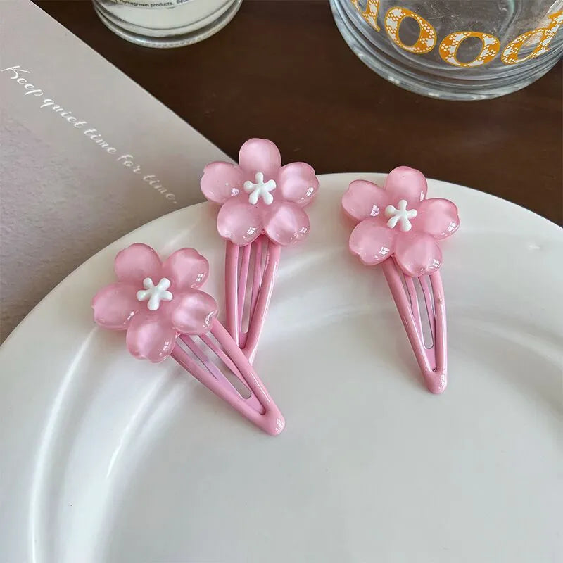 Handmade acrylic cherry blossom hair clip in pink floral design for women