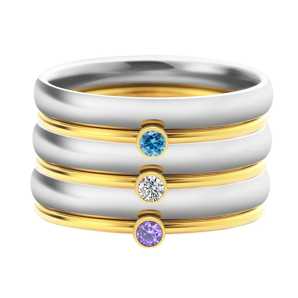 Titanium steel December birthstone ring with gold engraved lettering on a geometric band.