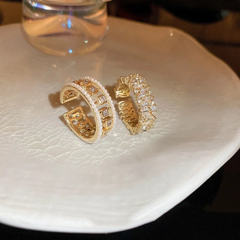 Pearl Hollowed-out Square Open-end Zircon Ring in gold, showcasing unique geometric design