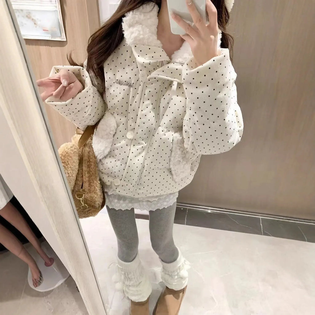 Beige cotton-padded coat with fur collar, dot pattern, and front pockets on a model