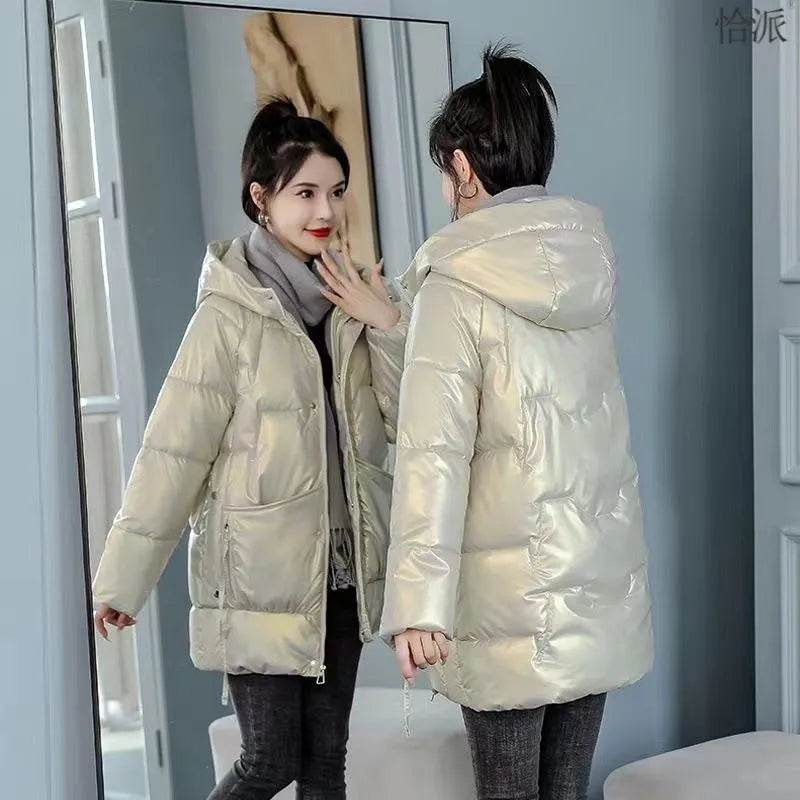 Women's loose thick hooded winter jacket in black, shown on a hanger.