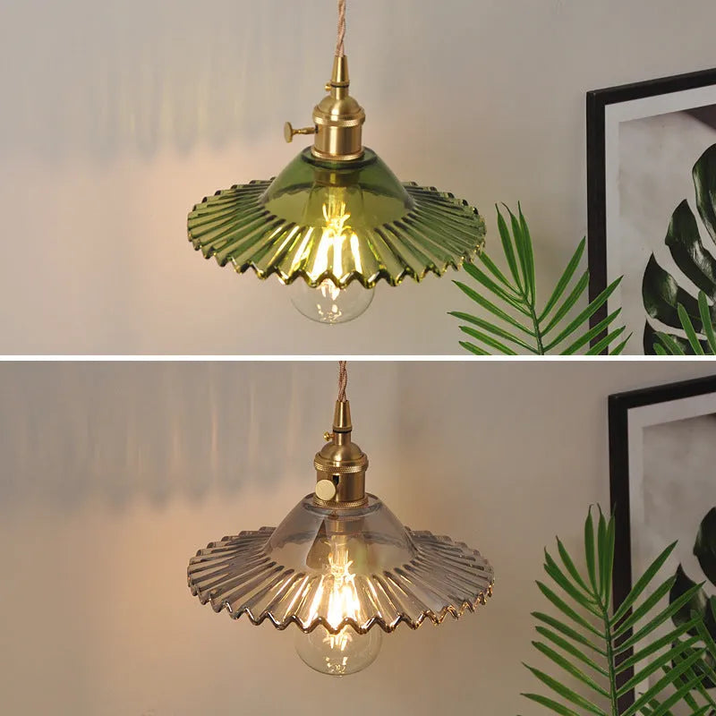 Retro copper lotus wall lamp with glass shade in choice of six colours on a wall.