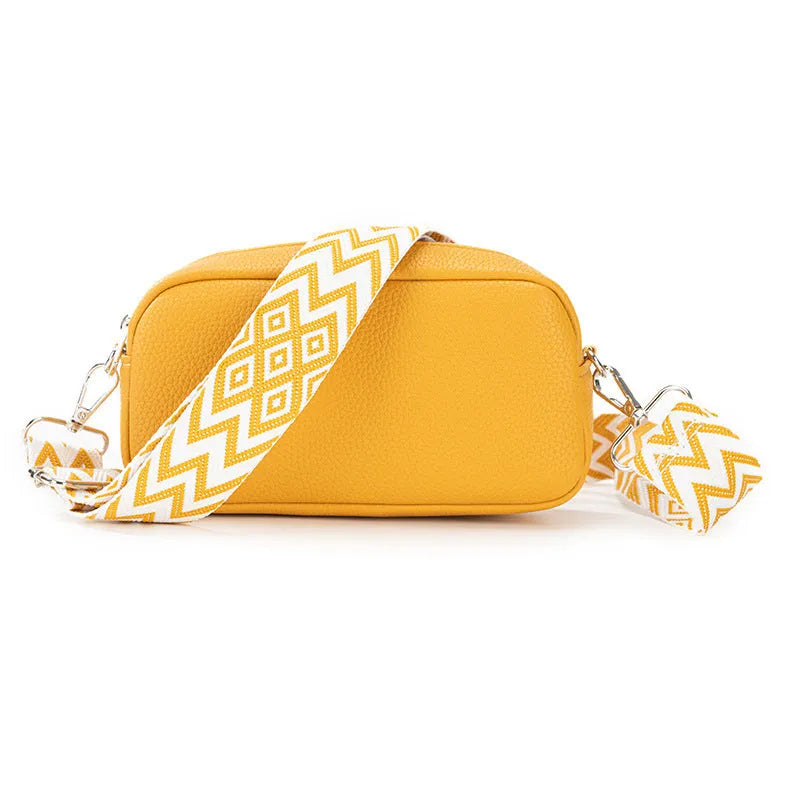 Women's soft PU crossbody bag in horizontal square shape showing internal zipper pocket and eight colour options