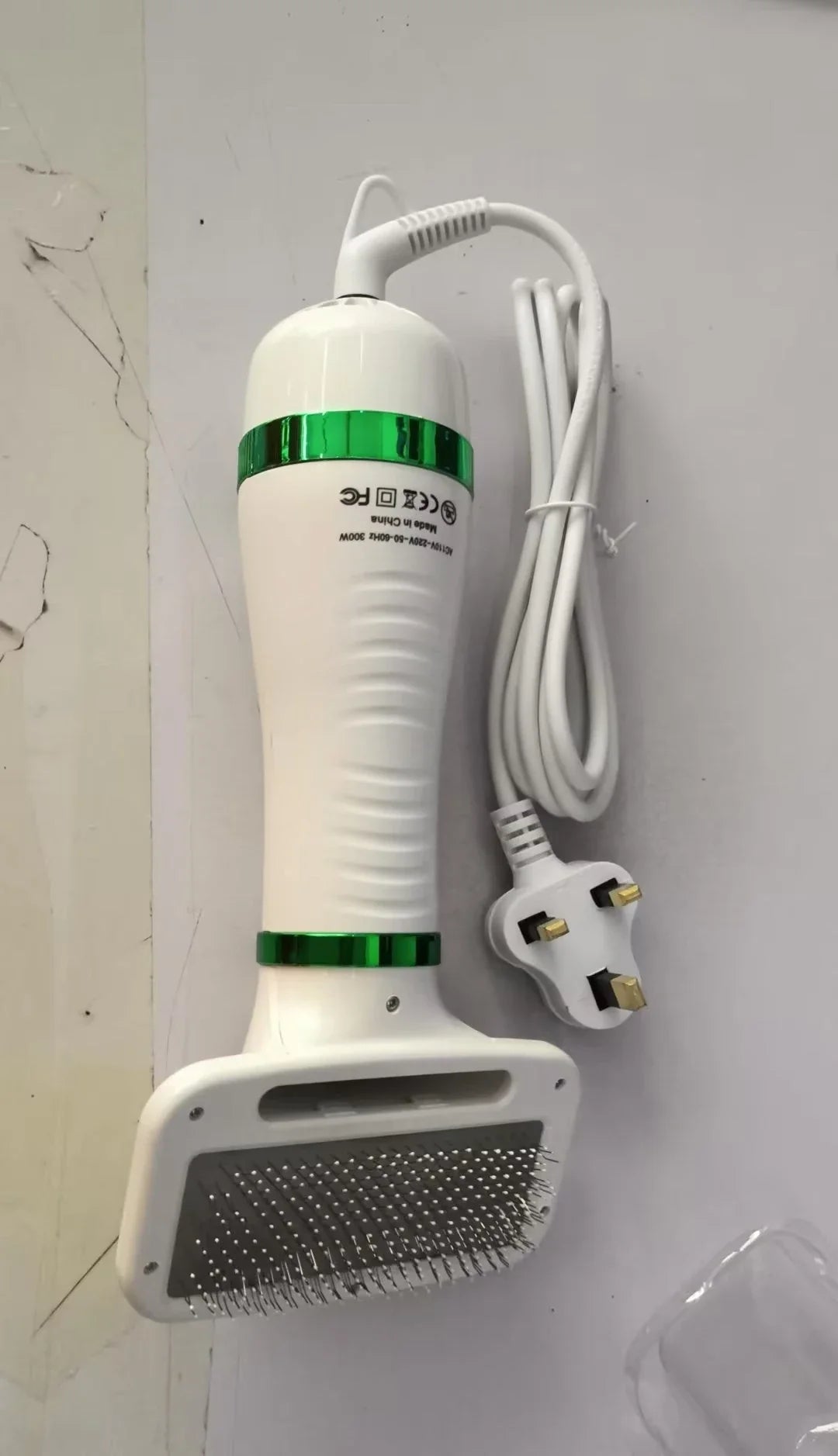 2-in-1 pet drying brush and hair dryer comb with adjustable heads for efficient grooming