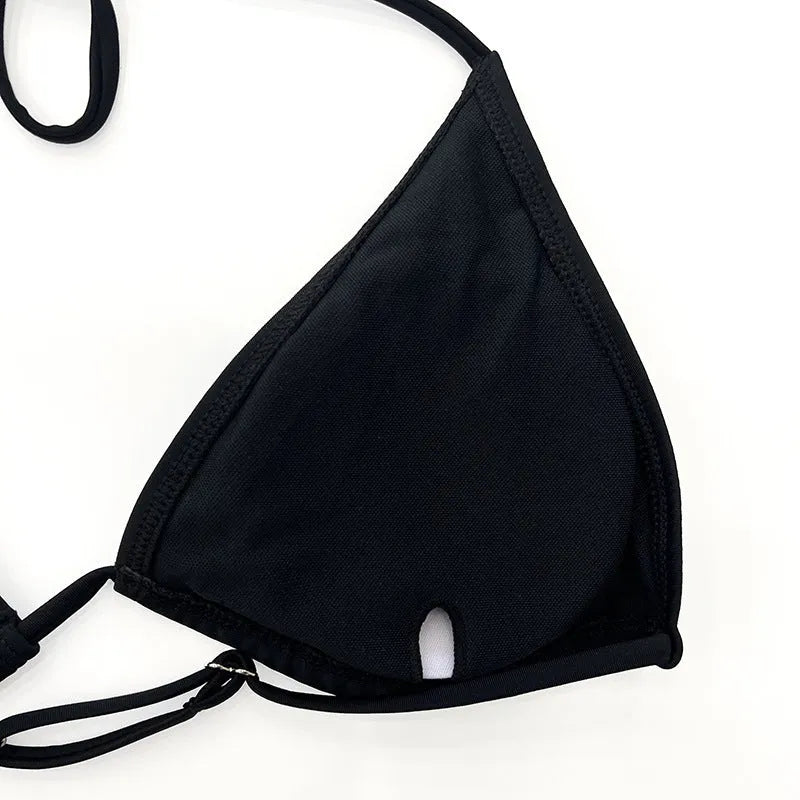 Black women's four-piece bikini swimsuit set with long sleeves for swimming sports.